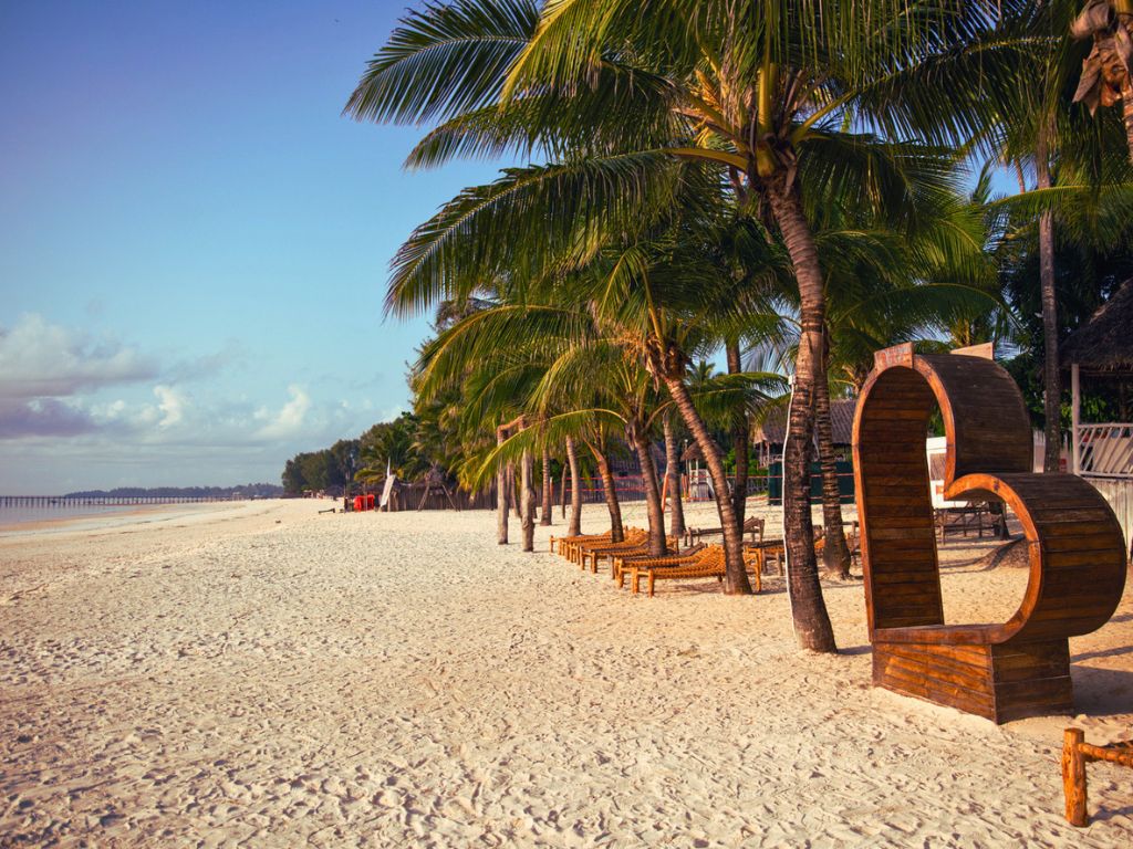 VOI Kiwengwa Resort Zanzibar pool surrounded by palm trees